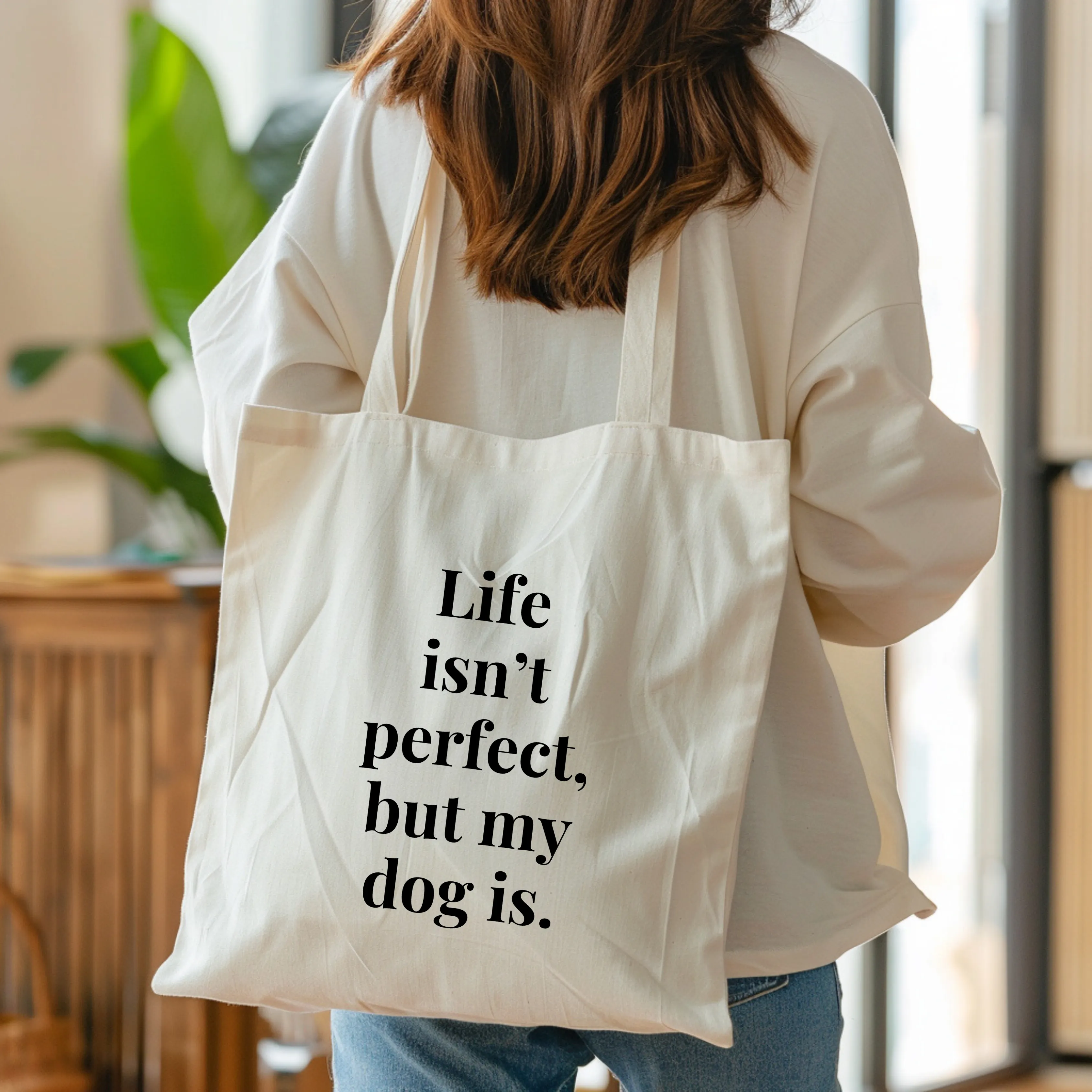 Life isn't perfect but my dog is tote bag